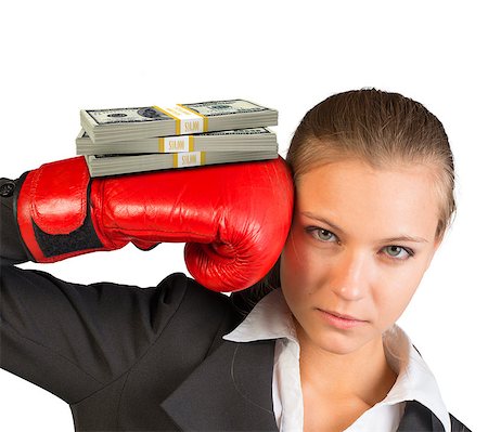 simsearch:400-08161703,k - Businesswoman in boxing gloves with bundle of money looking at camera on isolated white background Photographie de stock - Aubaine LD & Abonnement, Code: 400-08162919