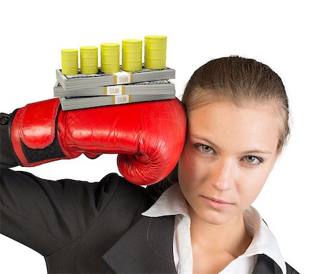 simsearch:400-08161703,k - Businesswoman in boxing gloves with gas cisterns and money looking at camera on isolated white background Photographie de stock - Aubaine LD & Abonnement, Code: 400-08162925