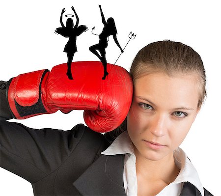 simsearch:400-08161703,k - Businesswoman in boxing gloves with angel and demon silhouettes looking at camera on isolated white background Photographie de stock - Aubaine LD & Abonnement, Code: 400-08162926