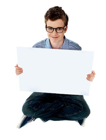 simsearch:400-06695536,k - Smiling boy holding a blank whiteboard. Copy space concept Stock Photo - Budget Royalty-Free & Subscription, Code: 400-08185056