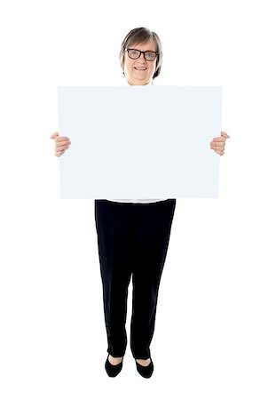 Senior female executive showing advertising board. Full length portrait Stock Photo - Budget Royalty-Free & Subscription, Code: 400-08185112