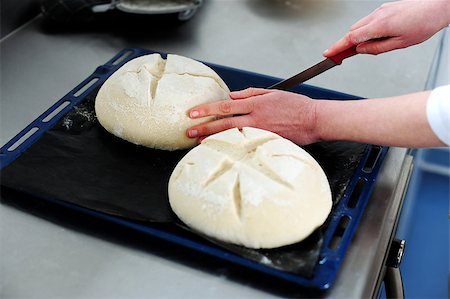 simsearch:400-07317346,k - Female cutting dough in a creative manner through knife. Focus on dough Stock Photo - Budget Royalty-Free & Subscription, Code: 400-08185130