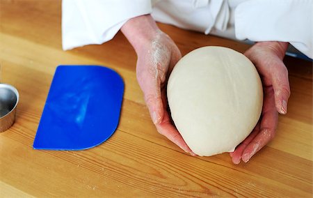 simsearch:400-07317346,k - Chefs hand holding a clean finished dough. Closeup shot Stock Photo - Budget Royalty-Free & Subscription, Code: 400-08185141