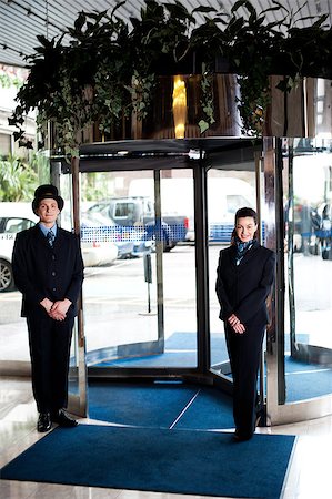 doorman full length - Door man with receptionist at the entrance. Parking area in background Stock Photo - Budget Royalty-Free & Subscription, Code: 400-08185219