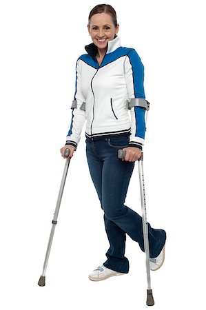 simsearch:400-07987656,k - Full length shot of a woman walking with the support of crutches. Stock Photo - Budget Royalty-Free & Subscription, Code: 400-08185378