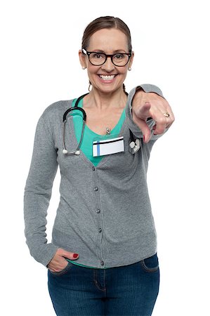 simsearch:400-08131186,k - Cheerful medical practitioner pointing at the camera. All on white background. Foto de stock - Royalty-Free Super Valor e Assinatura, Número: 400-08185397