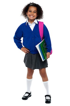 Girl in smart uniform holding notebook and calculator in hand and carrying pink backpack over shoulders. Stock Photo - Budget Royalty-Free & Subscription, Code: 400-08185562