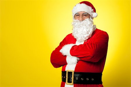 portrait picture adam and eve - Saint Nick posing confidently against yellow background, arms folded. Stock Photo - Budget Royalty-Free & Subscription, Code: 400-08185649