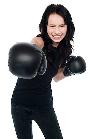 Cheerful young female boxer is ready to throw a punch. Isolated on white. Photographie de stock - Aubaine LD & Abonnement, Code: 400-08185970