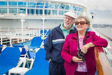 Happy Senior Couple Enjoying The View From Deck of a Luxury Passenger Cruise Ship. Stock Photo - Budget Royalty-Free & Subscription, Code: 400-08186385