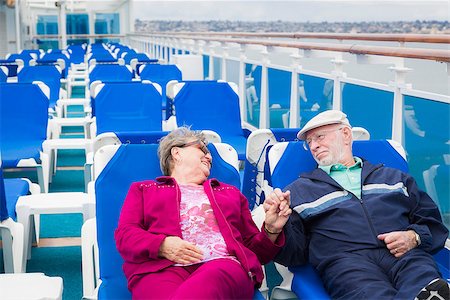 Happy Senior Couple Relaxing On The Deck of a Luxury Passenger Cruise Ship. Stock Photo - Budget Royalty-Free & Subscription, Code: 400-08186386
