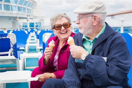Happy Senior Couple Enjoying Ice Cream On The Deck of a Luxury Passenger Cruise Ship. Stock Photo - Budget Royalty-Free & Subscription, Code: 400-08186387