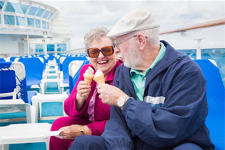 Happy Senior Couple Enjoying Ice Cream On The Deck of a Luxury Passenger Cruise Ship. Stock Photo - Budget Royalty-Free & Subscription, Code: 400-08186388
