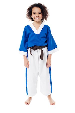 Young girl in karate uniform getting ready for practice Photographie de stock - Aubaine LD & Abonnement, Code: 400-08186618