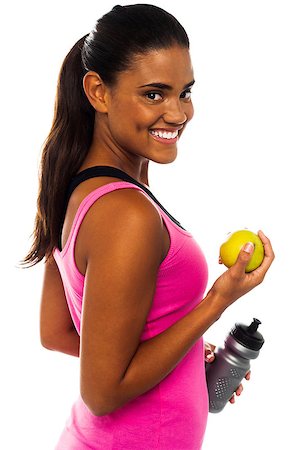 physical fit food - Athletic woman holding sipper bottle and fresh green apple Stock Photo - Budget Royalty-Free & Subscription, Code: 400-08186711
