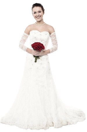 simsearch:400-05208182,k - Beautiful young woman in pretty wedding dress posing with a bouquet Photographie de stock - Aubaine LD & Abonnement, Code: 400-08186920