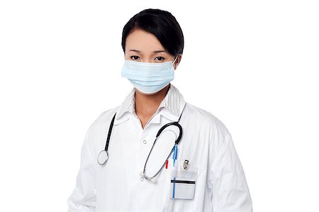 simsearch:400-08131186,k - Young female physician covering her face with surgical mask Stock Photo - Budget Royalty-Free & Subscription, Code: 400-08187111