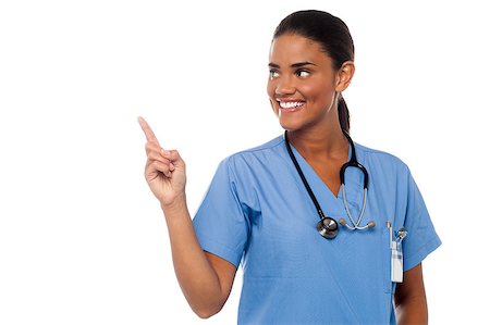 simsearch:400-08131186,k - Young smiling female physician looking and pointing away. Stock Photo - Budget Royalty-Free & Subscription, Code: 400-08187369