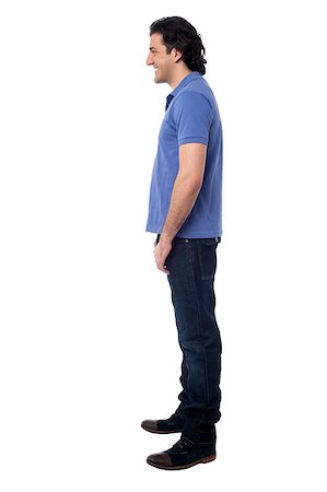 Isolated young handsome guy posing sideways in studio Stock Photo - Budget Royalty-Free & Subscription, Code: 400-08187452