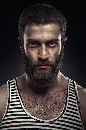 Portrait of a bearded man on dark background Stock Photo - Budget Royalty-Free & Subscription, Code: 400-08187963
