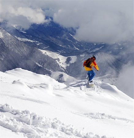 simsearch:400-08780271,k - Snowboarder on off-piste slope an mountains in haze. Caucasus Mountains, Georgia, ski resort Gudauri. Photographie de stock - Aubaine LD & Abonnement, Code: 400-08188192
