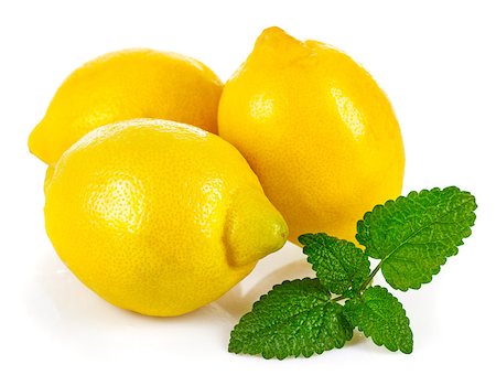 simsearch:400-07629553,k - Fresh lemons with leaves melissa. Isolated on white background Fotografie stock - Microstock e Abbonamento, Codice: 400-08188426