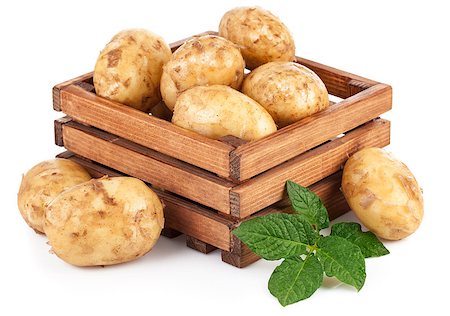 simsearch:400-07667021,k - New potatoes in box with green leaves. Isolated on white background Stock Photo - Budget Royalty-Free & Subscription, Code: 400-08188666