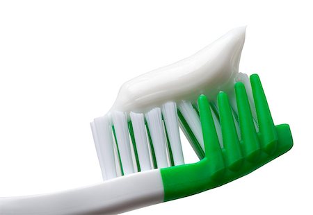 simsearch:400-06327889,k - Green toothbrush with toothpaste. Isolated on white background. Close-up view. Photographie de stock - Aubaine LD & Abonnement, Code: 400-08189227