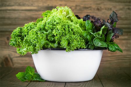simsearch:400-08375763,k - Fresh leaves lettuce and basil in dish on wooden board Stock Photo - Budget Royalty-Free & Subscription, Code: 400-08197281