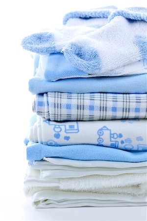 Stack of blue infant clothing for baby shower Stock Photo - Budget Royalty-Free & Subscription, Code: 400-08197366