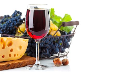 Glass red wine with grapes and cheese. Isolated on white background Stock Photo - Budget Royalty-Free & Subscription, Code: 400-08198253