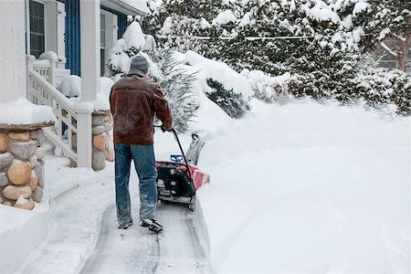 elenathewise (artist) - Man using snowblower to clear deep snow on driveway near residential house after heavy snowfall Stock Photo - Budget Royalty-Free & Subscription, Code: 400-08198806