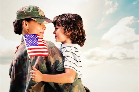 Solider reunited with son against blue sky Stock Photo - Budget Royalty-Free & Subscription, Code: 400-08200444