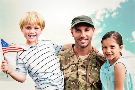 Soldier reunited with his children against blue sky Stock Photo - Budget Royalty-Free & Subscription, Code: 400-08200443