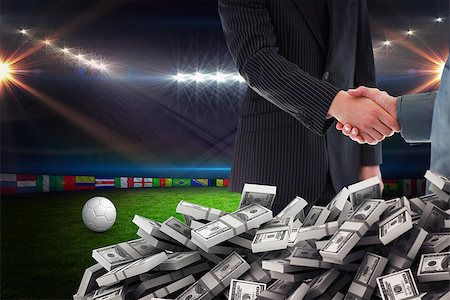 Business people shaking hands against football pitch with lights and flags Stock Photo - Budget Royalty-Free & Subscription, Code: 400-08200460