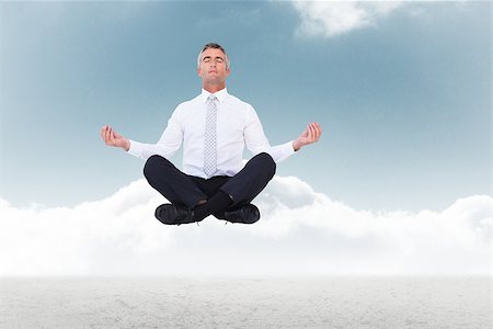 Zen businessman meditating in lotus pose against cloudy sky background Stock Photo - Budget Royalty-Free & Subscription, Code: 400-08200609
