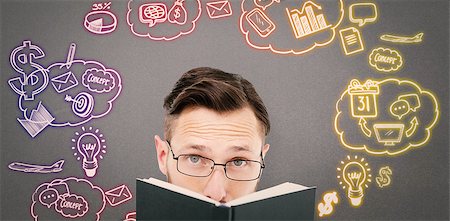 Young geek looking over black book against grey background Stock Photo - Budget Royalty-Free & Subscription, Code: 400-08200700