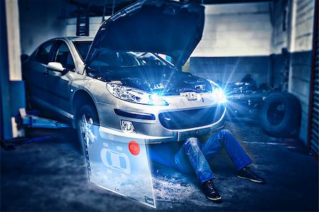 simsearch:400-06870131,k - Engineering interface against male mechanic working under car Photographie de stock - Aubaine LD & Abonnement, Code: 400-08224687