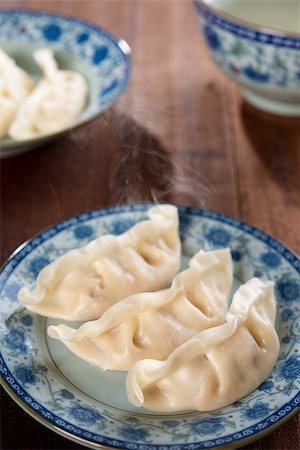 simsearch:400-08225258,k - Fresh dumpling on plate. Chinese cuisine on rustic vintage wooden background. Fractal on the plate is generic print. Foto de stock - Super Valor sin royalties y Suscripción, Código: 400-08224923