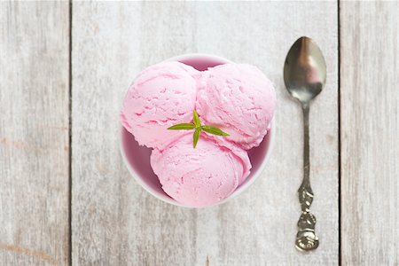 Top view scoops pink ice cream on bowl with spoon at rustic wooden vintage table background. Stock Photo - Budget Royalty-Free & Subscription, Code: 400-08225234