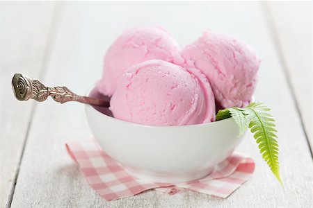 simsearch:400-08223858,k - Scoops pink ice cream in bowl with spoon on rustic wooden vintage table background. Photographie de stock - Aubaine LD & Abonnement, Code: 400-08225231