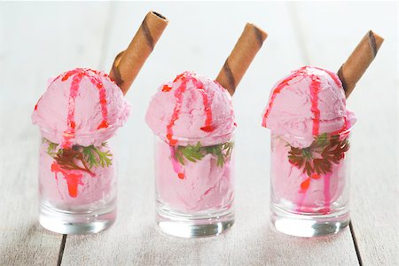 simsearch:400-08225242,k - Three glasses strawberry ice cream in cup with waffle on wooden vintage table background. Stockbilder - Microstock & Abonnement, Bildnummer: 400-08225241