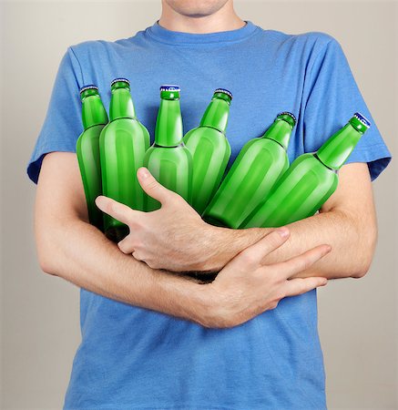 Consumer with a lot of bottles of beer in their hands Stock Photo - Budget Royalty-Free & Subscription, Code: 400-08221376