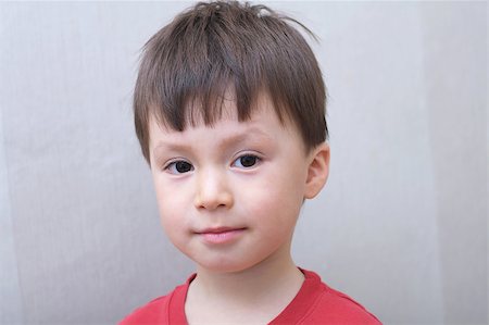 Caucasian boy face portrait in red skirt Foto de stock - Royalty-Free Super Valor e Assinatura, Número: 400-08221565