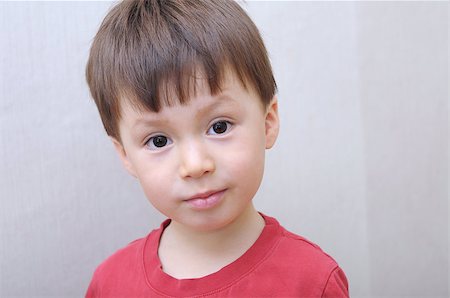Caucasian boy face portrait in red skirt Foto de stock - Royalty-Free Super Valor e Assinatura, Número: 400-08222037