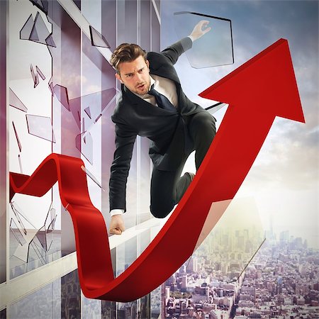 successful business man with graphs - Determined businessman over a big red arrow Stock Photo - Budget Royalty-Free & Subscription, Code: 400-08222366