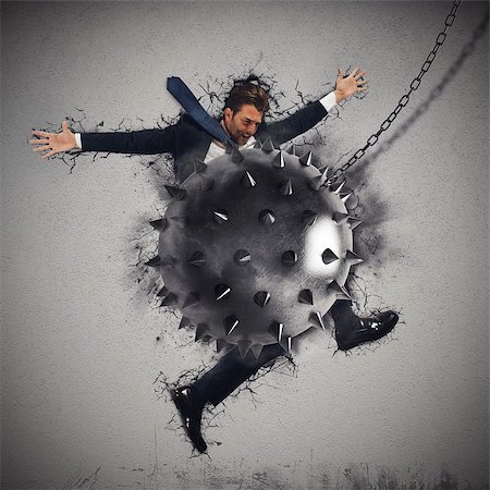 simsearch:400-05341942,k - Man crushed by a iron sharpened ball Stock Photo - Budget Royalty-Free & Subscription, Code: 400-08222420