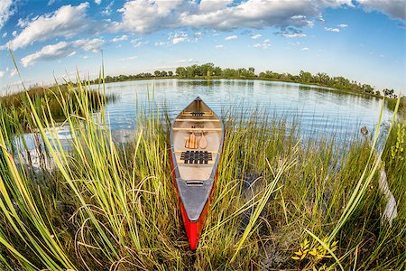 red canoe on lake - red canoe on a lake shore - distorted fish eye lens perspective, Fort Collins, Colorado Stock Photo - Budget Royalty-Free & Subscription, Code: 400-08222703