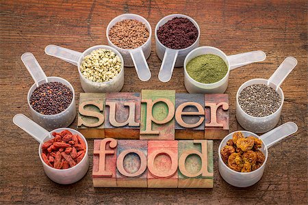 superfood abstract (wheatgrass, acai berry, goji berry, falx seed,chia seed,goldenberry,hemp seed, quinoa grain) - a set of measuring scoops with la letterpress text against rustic wood Stock Photo - Budget Royalty-Free & Subscription, Code: 400-08223205