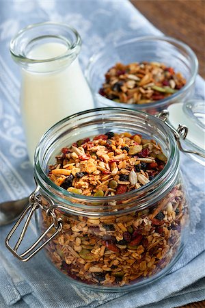 elenathewise (artist) - Homemade granola in open glass jar and milk or yogurt  on table with linens Stock Photo - Budget Royalty-Free & Subscription, Code: 400-08223987